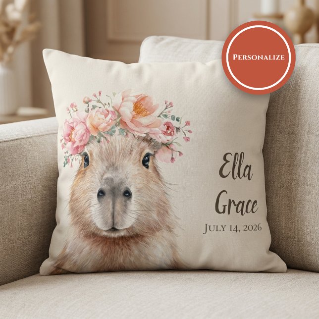 Cojín Decorativo Capybara Baby Nursery • Personalized  (soft nursery pillow with floral capybara illustration on beige sofa setting)