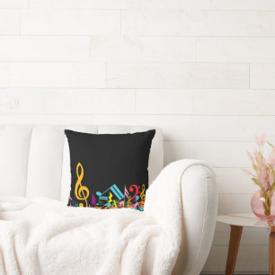 Cojín Decorativo Coloridas notas musicales jumled sobre negro