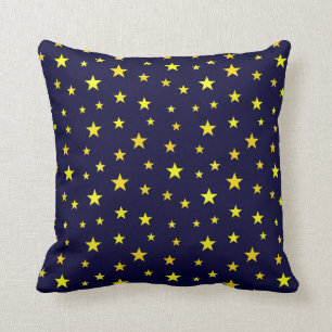 Cojín decorativo con estrellas sobre fondo azul m