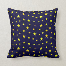 Cojín decorativo con estrellas sobre fondo azul ma