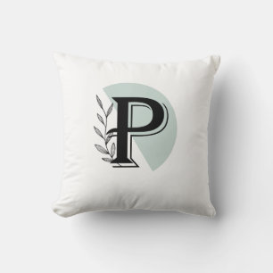 Cojín decorativo con letra P de hoja botánica con