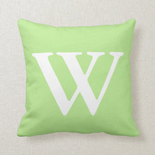 Cojín decorativo con monograma blanco de la verde
