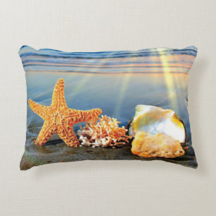 Cojín Decorativo conchas de mar y estrellas de mar en la playa