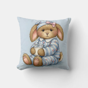 Cojín Decorativo Conejo en pijama azul con un vaso de leche