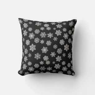 Cojín Decorativo Copo de nieve plateados sobre un fondo negro