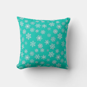 Cojín Decorativo Copos de nieve blancos de 3 d sobre un fondo turqu
