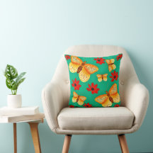 Cushion con mariposas y flores rojas