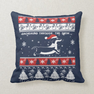 COJÍN DECORATIVO DACHSHUND A TRAVÉS DE LA NIEVE