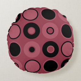 Cojín decorativo de círculos rosados y negros