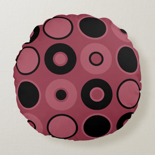 Cojín decorativo de círculos rosados y negros (Anverso)