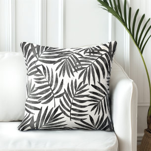 Cojín decorativo de hojas de palma negras y blanca