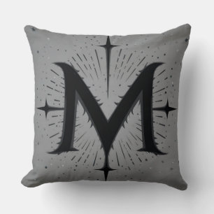 Cojín Decorativo Diseño 'M' negro elegante con estrellas simétricas
