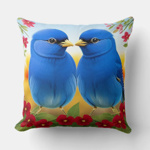 Cojín Decorativo Dos pájaros azules posados entre floraciones color