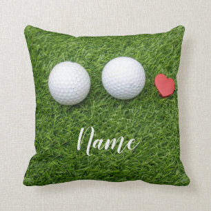 Cojín Decorativo Dos pelotas de golf y corazón de amor en el césp