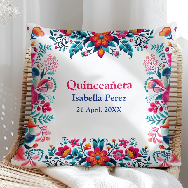 Cojín Decorativo Fiesta Mexicana Floral Quinceanera Cumpleaños (Floral Quinceanera Mexican Fiesta Birthday Throw Pillow on a sunny rattan chair.)