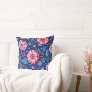Cojín Decorativo Flores rosadas sobre un patrón azul vibrante