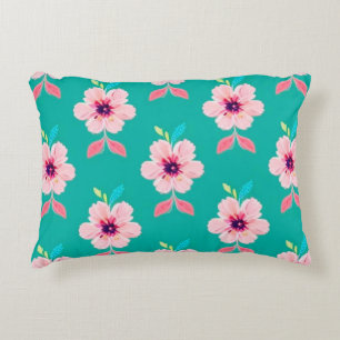 Cojín Decorativo Flores rosadas y hojas sobre fondo azul turquesa