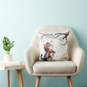 Cojín Decorativo Gatito observando la nieve que cae desde una rama