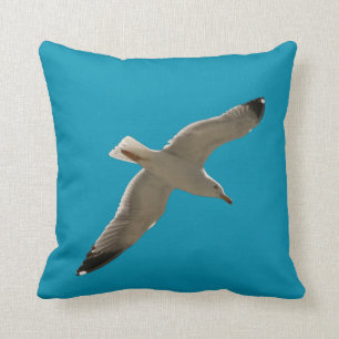 Cojín Decorativo Gaviota en un cielo azul