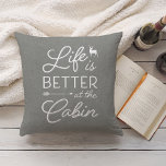Cojín Decorativo Gray & White Life Is Better At The Cabin<br><div class="desc">Rustic modern throw pillow features a medium gray background with "life is better at the cabin" overlaid in white typography. Personalize the reverse side with your family name and year established.</div>