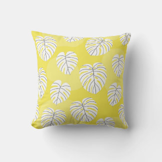 Cojín Decorativo Hojas de monstera, fondo amarillo brillante.