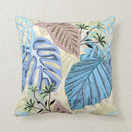 Cojín Decorativo Hojas tropicales azules y violetas.