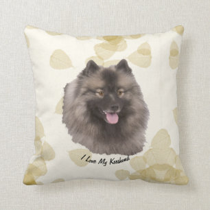 Cojín Decorativo Keeshond en las hojas del moreno