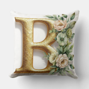 Cojín Decorativo Letra B dorada rodeada de arreglos florales
