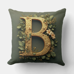 Cojín Decorativo Letra B dorada rodeada de arreglos florales