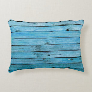 Cojín Decorativo Madera natural azul, fondo texturado.