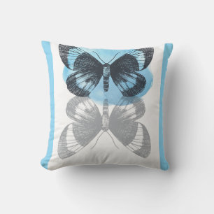Cojín Decorativo Magia de mariposa azul.