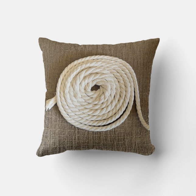 Cojín decorativo marrón con bobina blanca (Reverso)