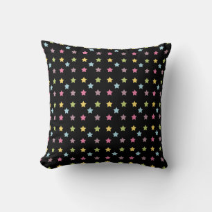 Cojín decorativo negro con estrellas coloridas