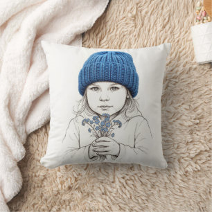 Cojín Decorativo Niña con un sombrero azul de punto