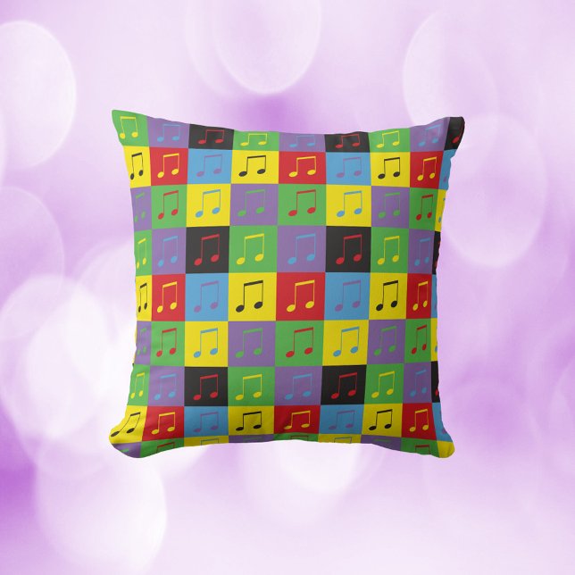 Cojín Decorativo Patrón de arte pop de notas musicales (A throw pillow with a pop art music note pattern)