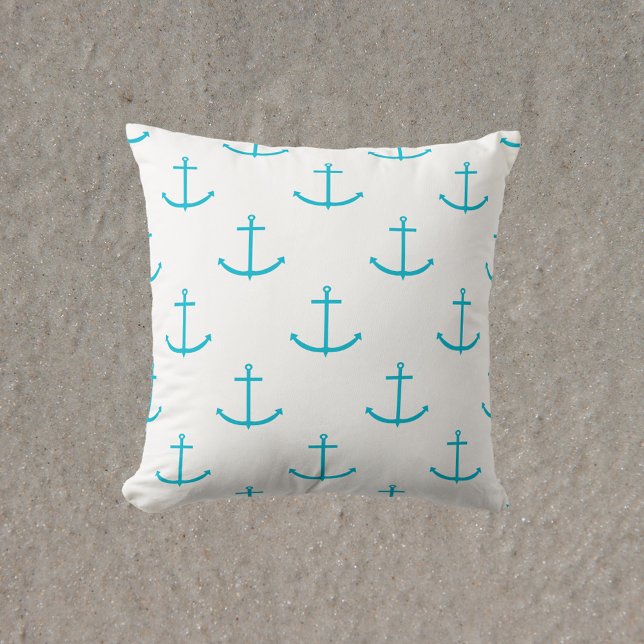 Cojín Decorativo Patrón Turquesa de anclaje (A throw pillow with a pattern of turquoise anchors)