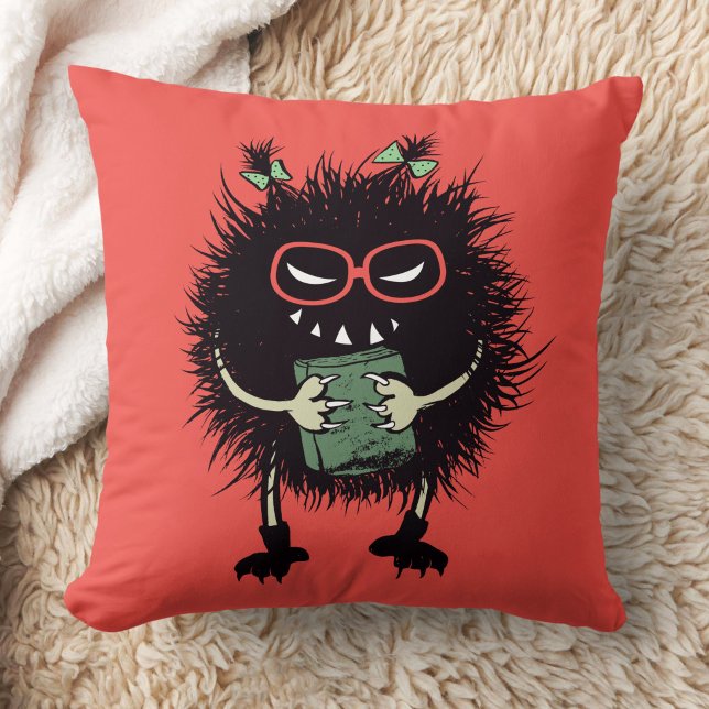 Cojín Decorativo Personaje de amante del libro malvado - Edgy Readi (orange red pillow with an evil character with eyeglasses and ponytails grinning and holding a book)