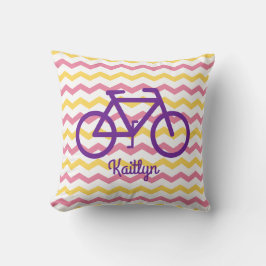 Cojín Decorativo Pilar Chevron rosa y amarillo con bicicleta morada