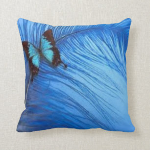 Cojín Decorativo pluma azul de la mariposa