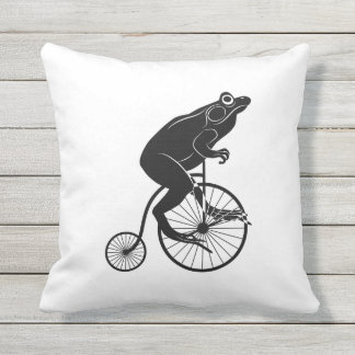 Cojín Decorativo Rana o sapo blanco y negro en una bici
