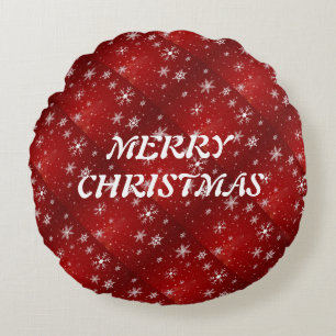 Cojín decorativo redondo de fondo rojo con copos d