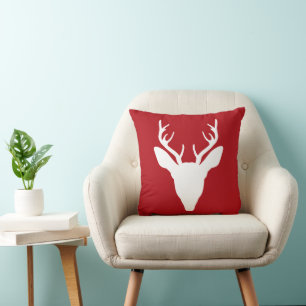 Cojín Decorativo Silueta de cabeza de ciervo blanco sobre rojo