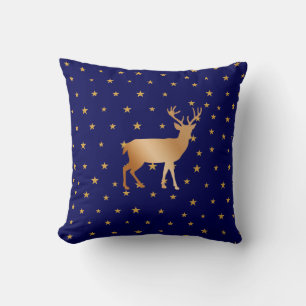 Cojín Decorativo Silueta de reno dorado y estrellas sobre azul mari