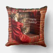 Tres gatitos en una media de Navidad