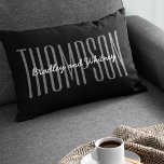 Cojín Lumbar Custom Modern Black Family Name<br><div class="desc">Simple modern family home pillow featuring a stylish black background,  your last name in a large clean typeface and your first names in a elegant script font.

Everything on this pillow can be customized to suit the style of your home,  this would be a unique gift for newlyweds.</div>
