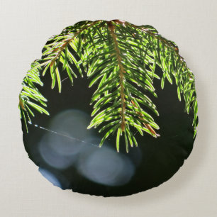 Cojín Redondo Agujas de pino con bokeh