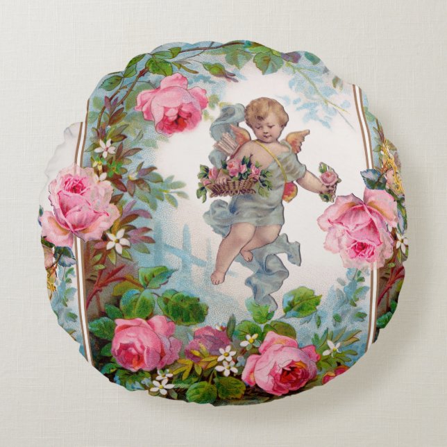 COJÍN REDONDO ÁNGEL ROMÁNTICO RECOLECTANDO ROSAS Y FLORES ROSADA (Anverso)