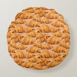 Cojín Redondo Cruasán dorado, panadería sin fisuras.