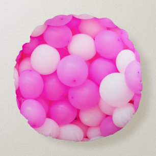 Cojín Redondo Diseño de fondo festivo de globos rosados.