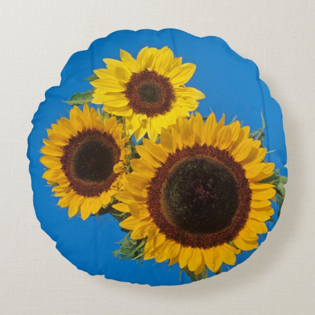 Cojín Redondo Girasoles contra cerca azul (Anverso)